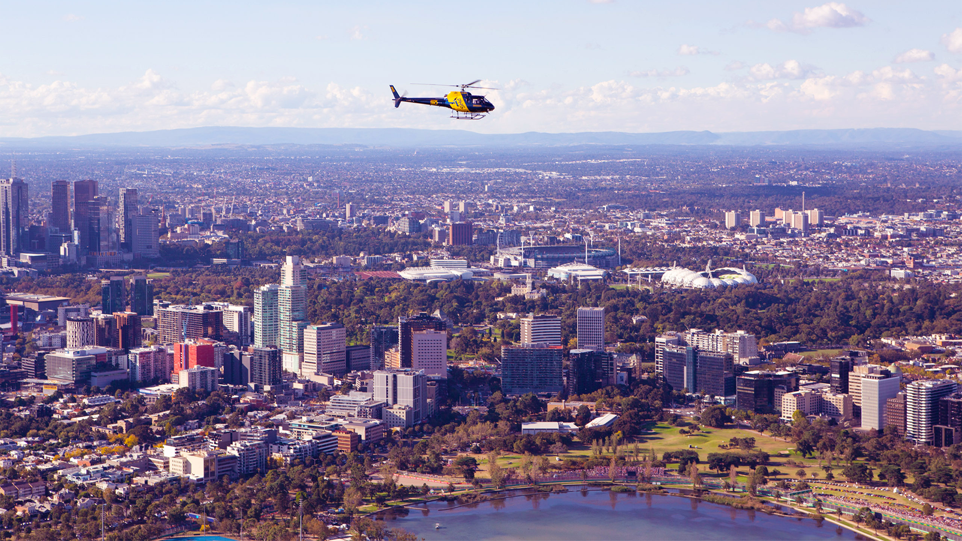 Scenic helicopter flight overlooking Albert Park Circuit, Melbourne skyline, and Port Phillip Bay